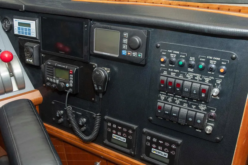 Slide: The Image of Control panel of a 2002 Hatteras 63 Raised Pilothouse Motor Yacht with navigation and communication equipment. - 33