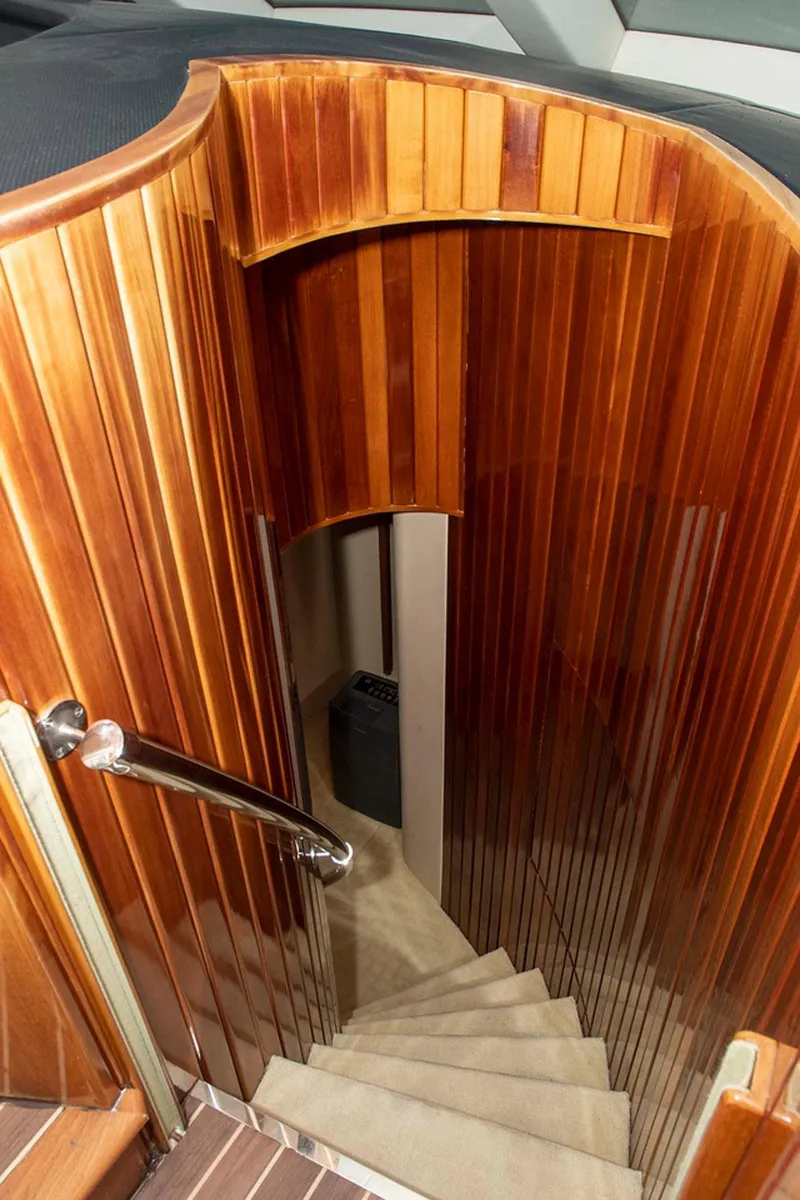 Slide: The Image of Wooden staircase inside 2002 Hatteras 63 Raised Pilothouse Motor Yacht. - 36