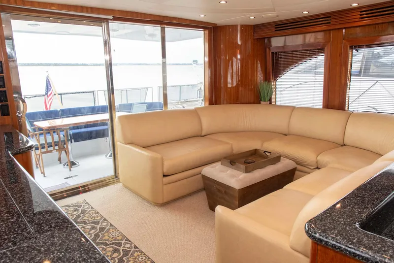 Slide: The Image of Luxurious interior of 2002 Hatteras 63 Raised Pilothouse Motor Yacht with beige seating. - 4