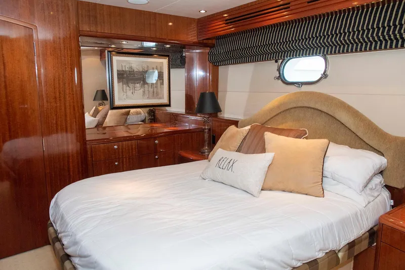 Slide: The Image of Luxurious bedroom in 2002 Hatteras 63 Raised Pilothouse Motor Yacht with elegant wood finishes. - 40