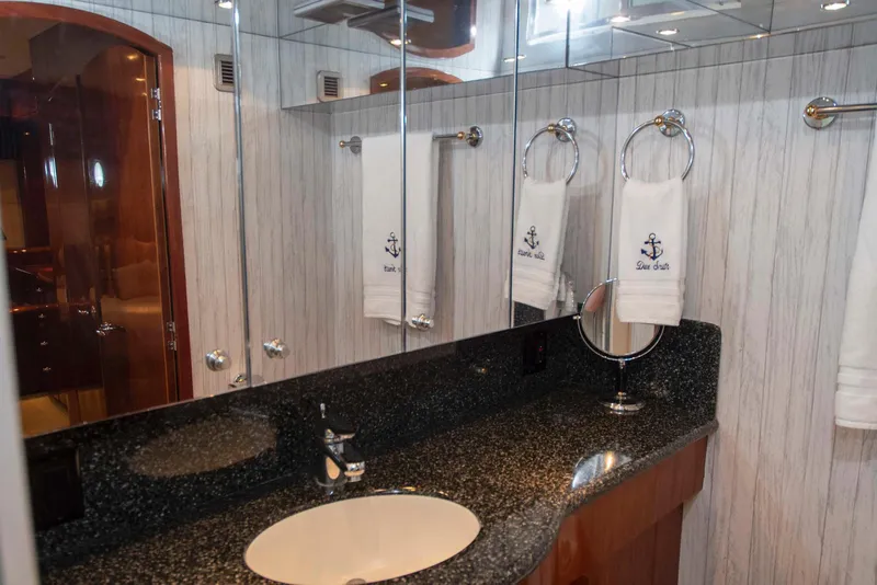 Slide: The Image of Luxurious bathroom in 2002 Hatteras 63 Raised Pilothouse Motor Yacht with granite countertop. - 44