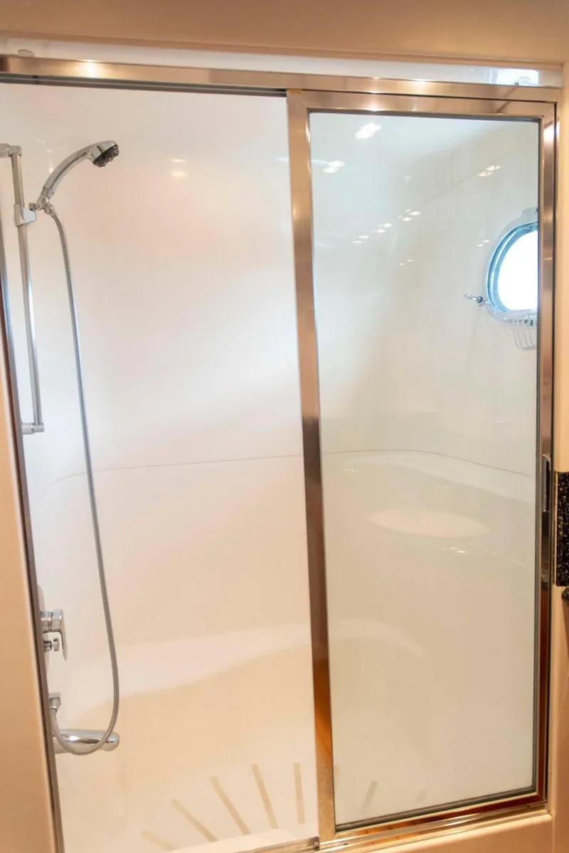 Slide: The Image of Shower area in 2002 Hatteras 63 Raised Pilothouse Motor Yacht with sliding glass door. - 45