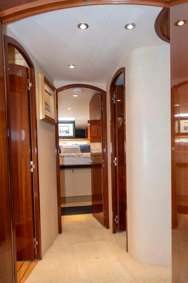 Slide: The Image of Interior hallway of 2002 Hatteras 63 Raised Pilothouse Motor Yacht with wooden doors and modern lighting. - 46