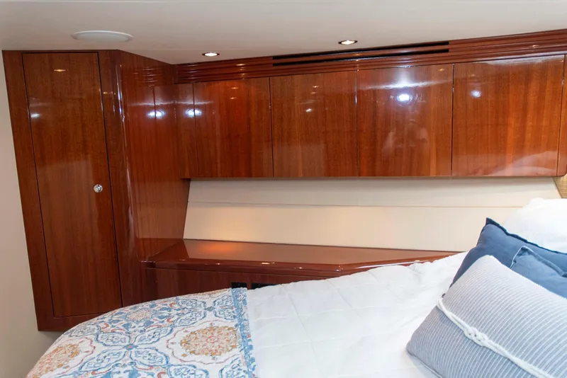 Slide: The Image of Luxurious cabin interior of 2002 Hatteras 63 Raised Pilothouse Motor Yacht with wood cabinetry. - 47