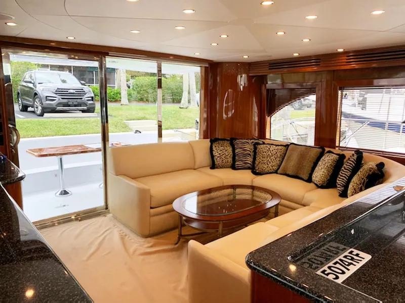 Slide: The Image of Luxurious interior of 2002 Hatteras 63 Raised Pilothouse Motor Yacht with plush seating. - 6