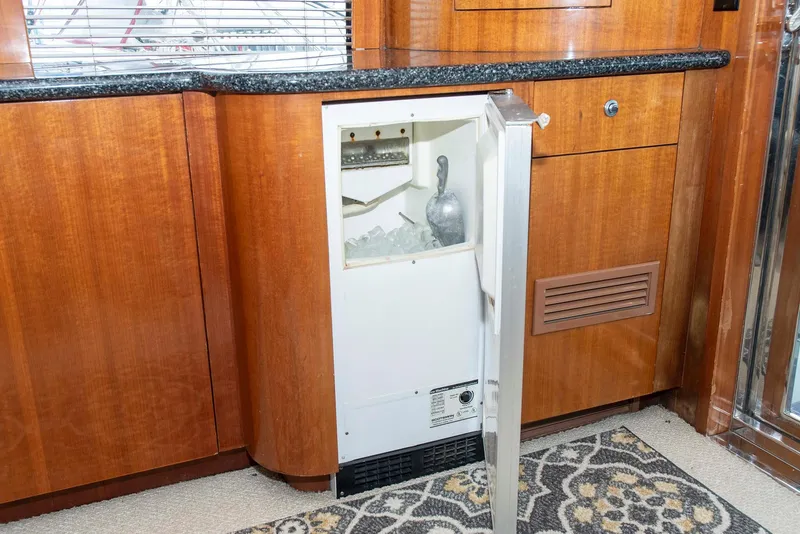 Slide: The Image of Ice maker in 2002 Hatteras 63 Raised Pilothouse Motor Yacht galley with wooden cabinetry. - 8