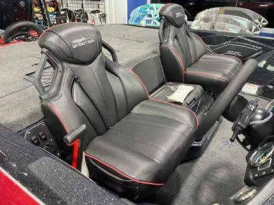 Slide: The Image of 2025 Skeeter ZXR 21 boat seats with black leather and red accents. - 2