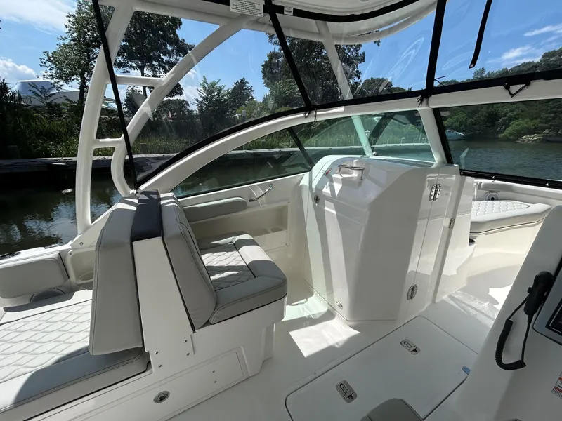Slide: The Image of 2026 Pursuit DC 246 Dual Console boat interior with sleek seating and modern design. - 12