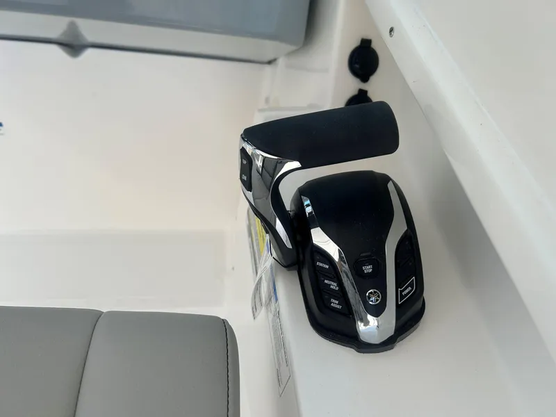 Slide: The Image of Throttle control of 2026 Pursuit DC 246 Dual Console boat, featuring modern design and functionality. - 16