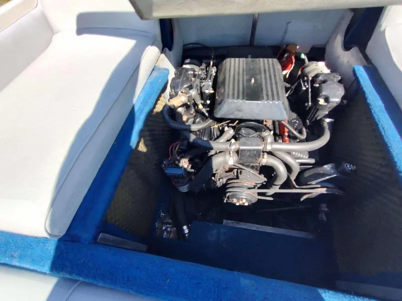 Slide: The Image of Engine compartment of 1988 Sea Ray 230 Bow Rider Select boat. - 13