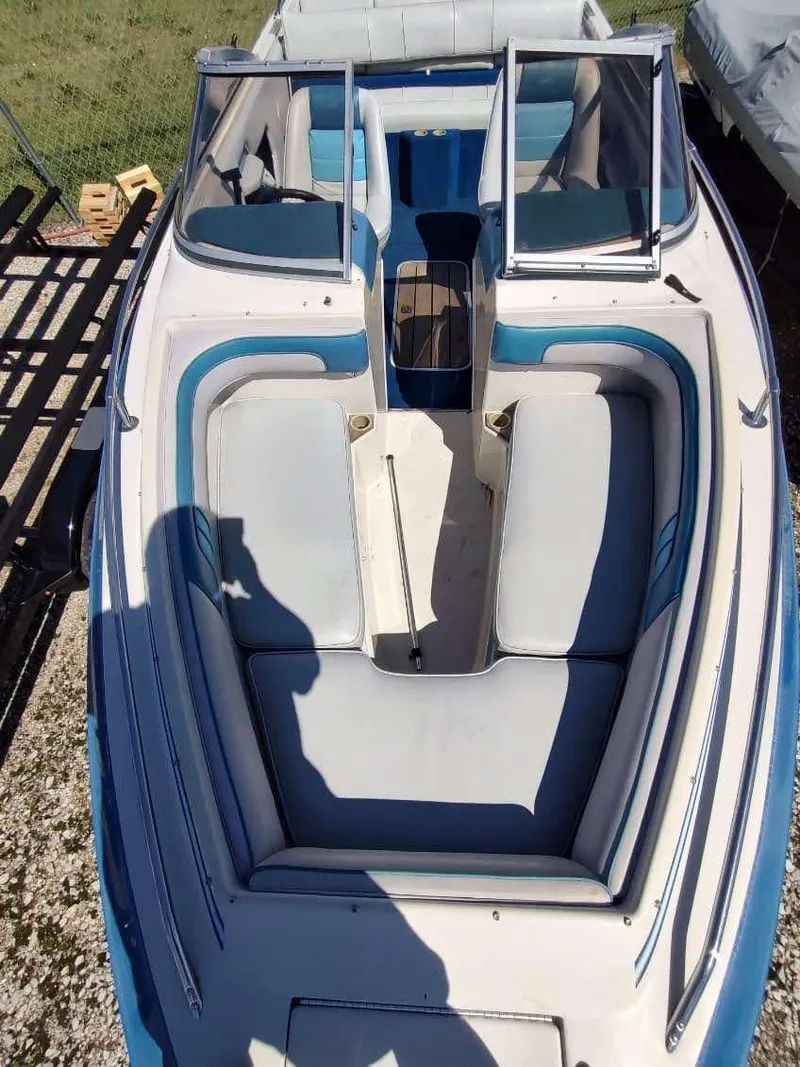 Slide: The Image of 1988 Sea Ray 230 Bow Rider Select with blue and white seating, viewed from above. - 2
