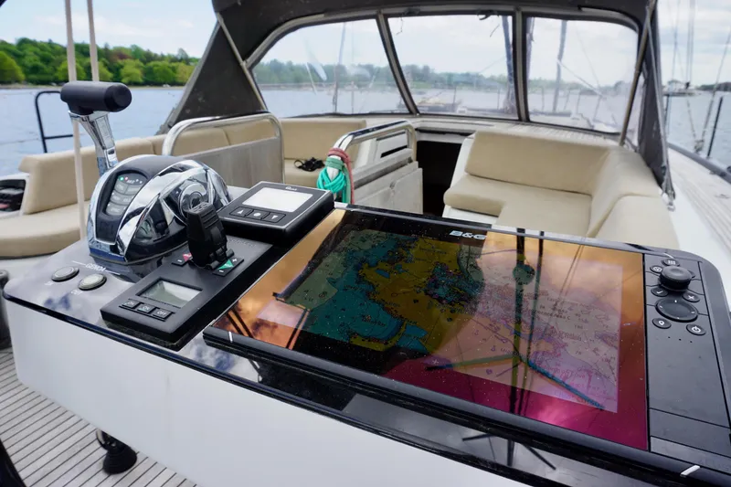 Slide: The Image of Cockpit of 2020 Beneteau First 53 yacht with navigation equipment and seating. - 14