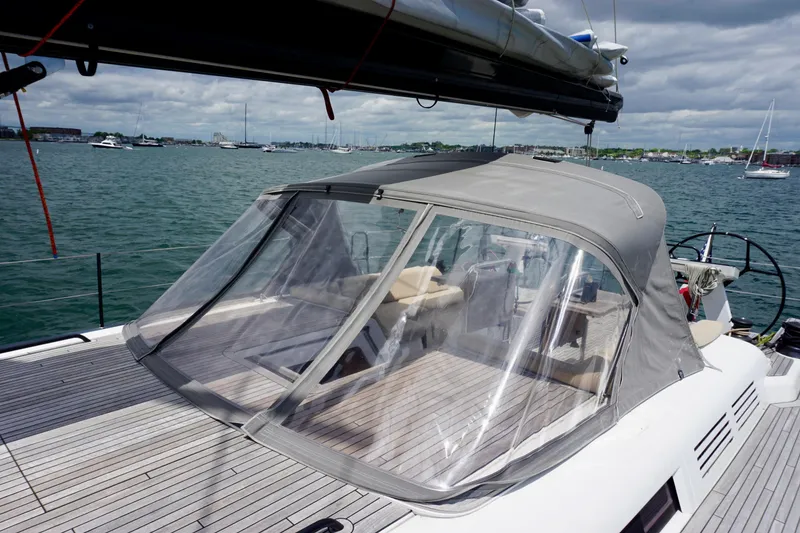 Slide: The Image of Beneteau First 53 yacht, 2020 model, with covered cockpit on calm waters. - 16