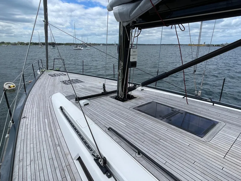 Slide: The Image of Sleek deck of 2020 Beneteau First 53 sailboat on calm waters. - 19