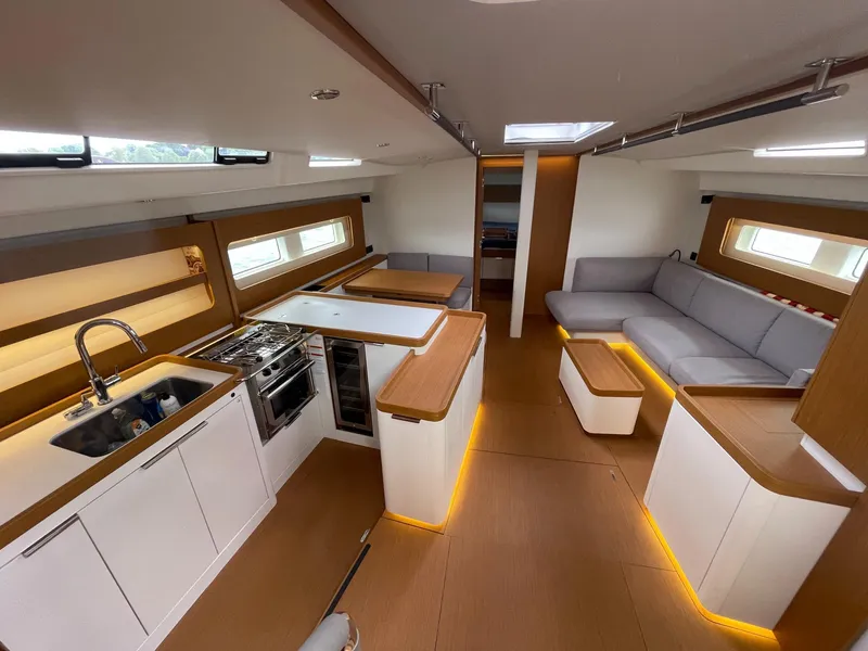 Slide: The Image of Luxurious interior of 2020 Beneteau First 53 yacht with modern kitchen and seating area. - 29