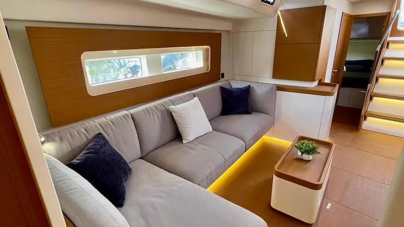 Slide: The Image of Luxurious interior of 2020 Beneteau First 53 yacht with modern seating and ambient lighting. - 31