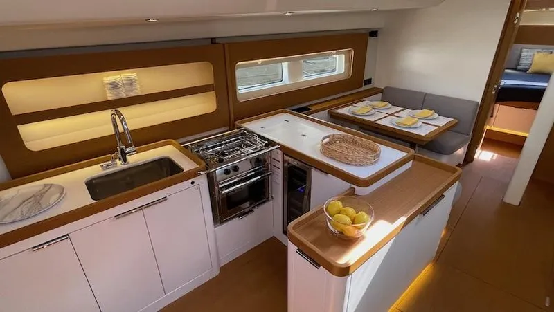 Slide: The Image of Luxurious interior of 2020 Beneteau First 53 yacht with modern kitchen and dining area. - 36