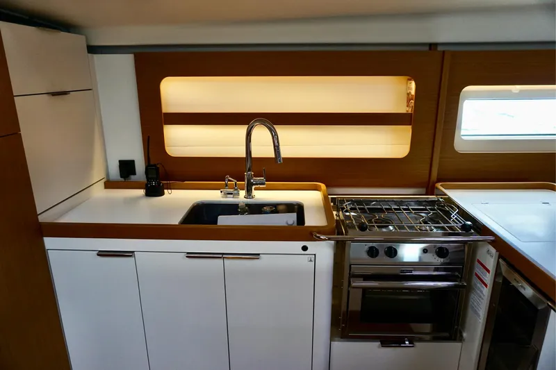 Slide: The Image of Modern kitchen interior of 2020 Beneteau First 53 yacht with sink and stove. - 39