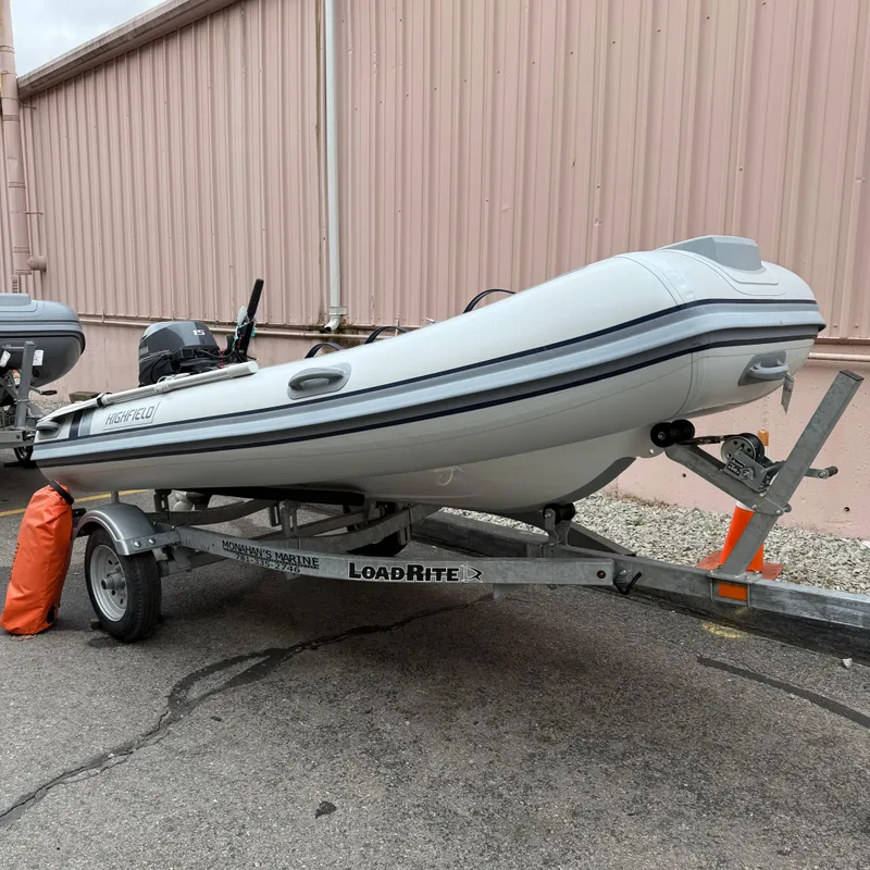 The Image of 2024 Highfield CL340 inflatable boat on a Load Rite trailer. - 0