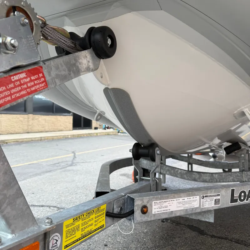 Slide: The Image of 2024 Highfield CL340 boat on trailer, close-up view of hull and winch. - 12