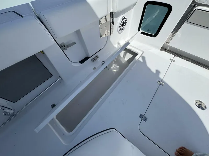 Slide: The Image of 2025 Sportsman 352 Open boat interior with open storage compartment and speaker. - 10