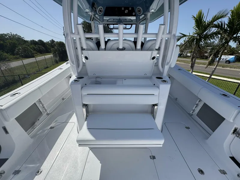 Slide: The Image of 2025 Sportsman 352 Open boat interior with seating and console, featuring sleek white design. - 12