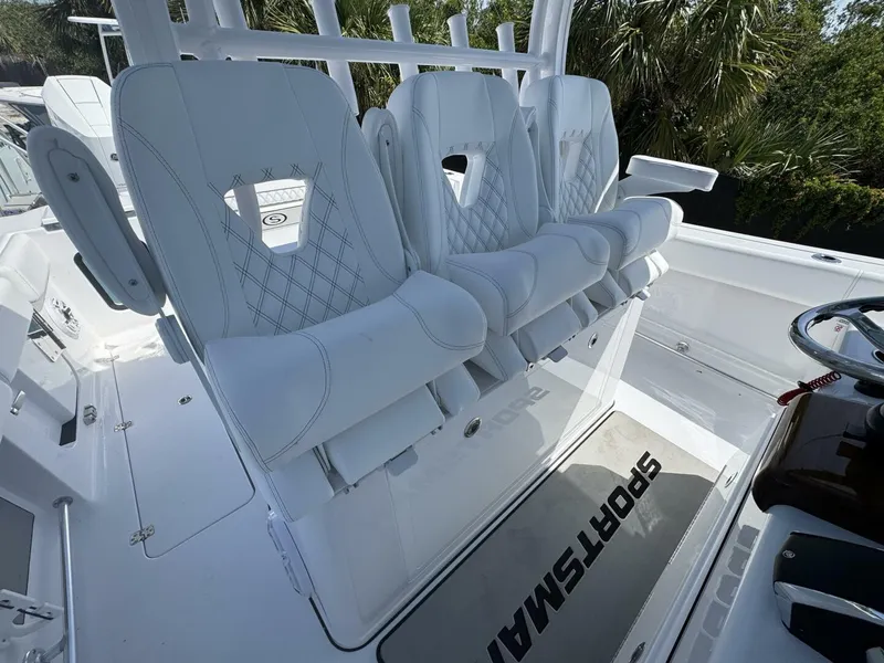 Slide: The Image of Luxury seating on 2025 Sportsman 352 Open boat, featuring white cushioned chairs. - 16