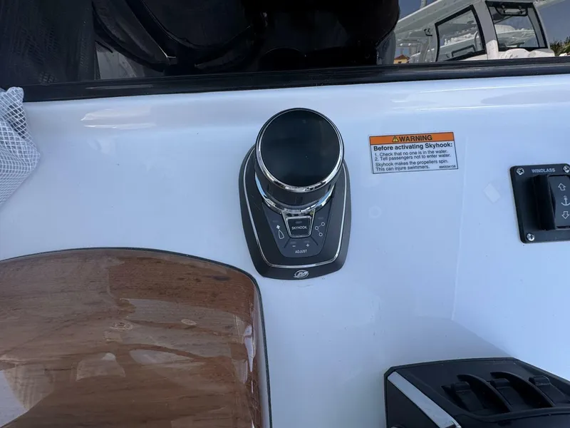 Slide: The Image of Control panel of 2025 Sportsman 352 Open boat with Skyhook feature and warning label. - 18