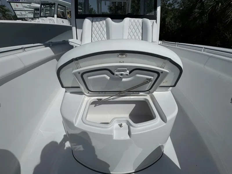 Slide: The Image of 2025 Sportsman 352 Open boat with open storage compartment, white seating, and sleek design. - 26