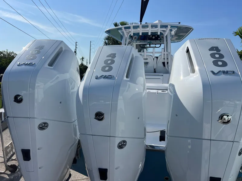 Slide: The Image of 2025 Sportsman 352 Open with triple 400 V12 engines, showcasing powerful marine performance. - 28