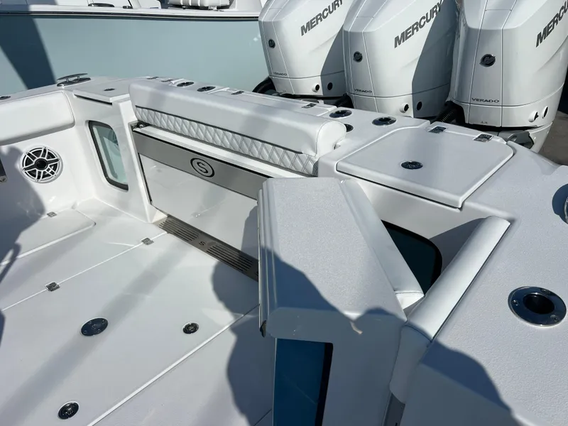 Slide: The Image of 2025 Sportsman 352 Open boat with Mercury engines, featuring sleek white deck design. - 31