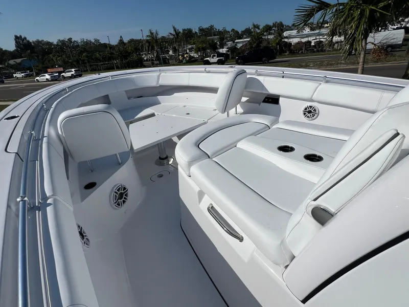 Slide: The Image of 2025 Sportsman 352 Open boat interior with white seating and table, showcasing luxury design. - 33