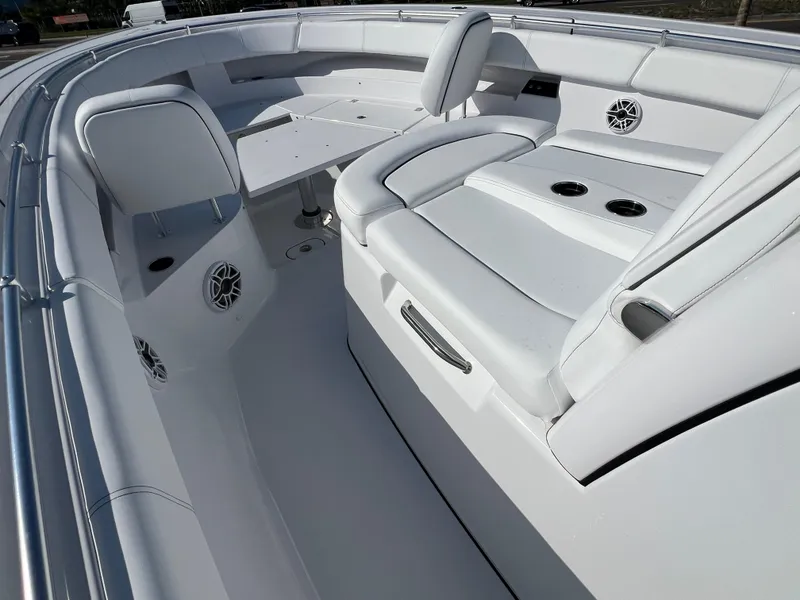 Slide: The Image of 2025 Sportsman 352 Open boat interior with white seating and cup holders. - 34