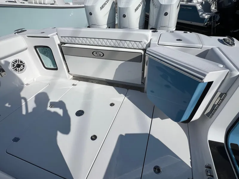 Slide: The Image of 2025 Sportsman 352 Open boat deck with storage and seating, featuring modern design elements. - 36