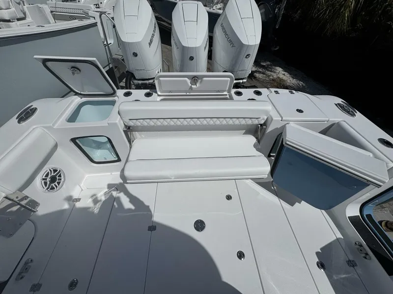 Slide: The Image of 2025 Sportsman 352 Open boat deck with seating and storage compartments. - 8