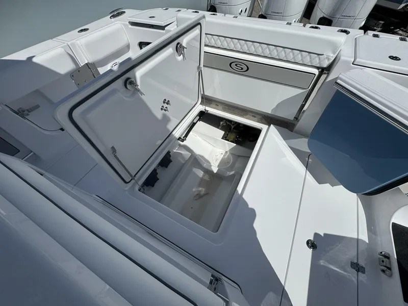 Slide: The Image of 2025 Sportsman 352 Open boat with open storage compartment and sleek white interior design. - 9