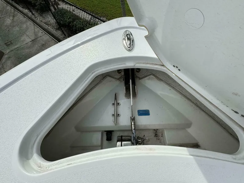 Slide: The Image of Anchor compartment of 2025 Sportsman 232 Open boat, open lid view. - 12