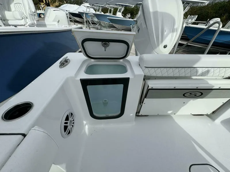 Slide: The Image of 2025 Sportsman 232 Open boat interior with storage compartments and seating. - 4
