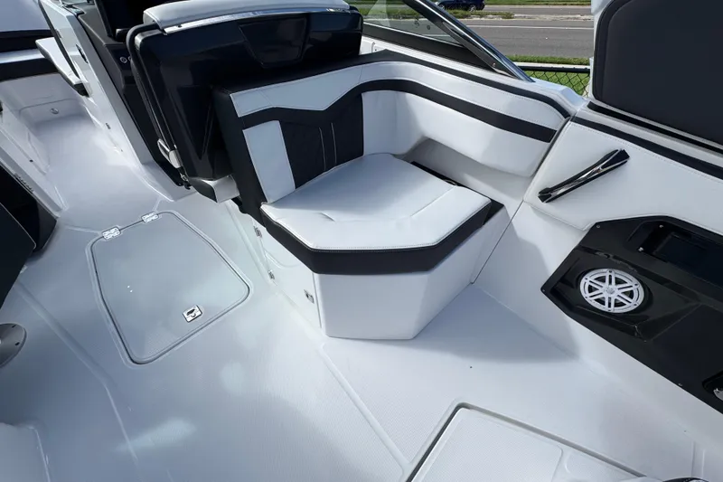 Slide: The Image of 2025 Monterey M-255 boat interior with sleek seating and modern speaker system. - 10
