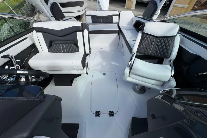 Slide: The Image of Luxurious interior of 2025 Monterey M-255 boat with modern seating and sleek design. - 12
