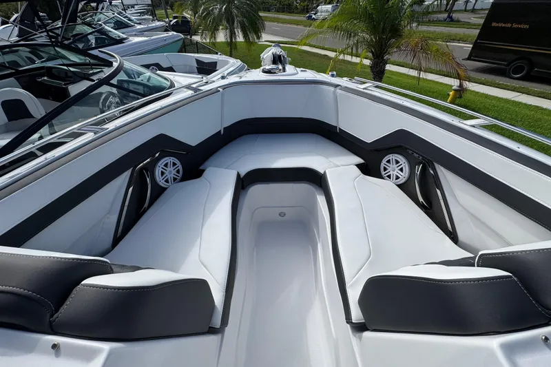 Slide: The Image of 2025 Monterey M-255 boat interior with sleek white seating and modern design. - 18