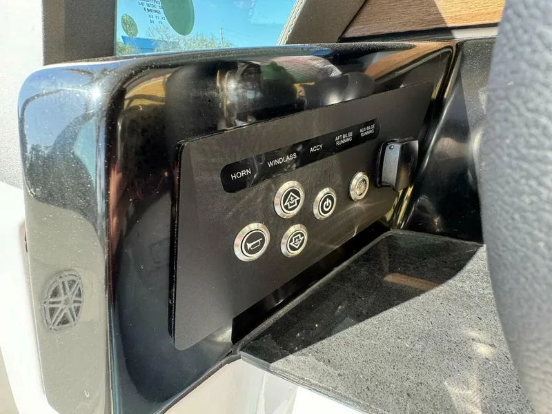 Slide: The Image of Control panel of a 2025 Monterey 30 ELITE boat with various function buttons. - 12