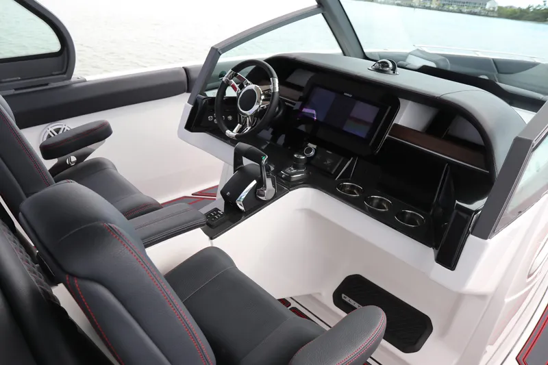 Slide: The Image of 2026 Monterey Elite 30 OB boat interior with modern dashboard and steering wheel. - 13