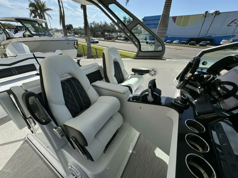 Slide: The Image of 2025 Monterey 30 ELITE boat interior with luxurious seating and modern dashboard controls. - 5