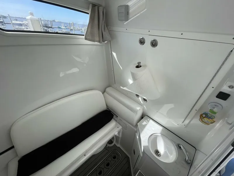 Slide: The Image of Interior of 2021 Sportsman 302 OPEN boat with seating and sink. - 13