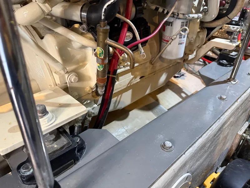 Slide: The Image of Engine compartment of a 1998 Carver 530 VOYAGER yacht, showcasing mechanical components. - 10