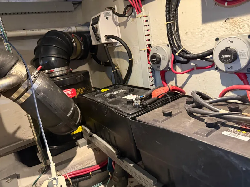 Slide: The Image of Engine room of 1998 Carver 530 Voyager with batteries and wiring. - 17