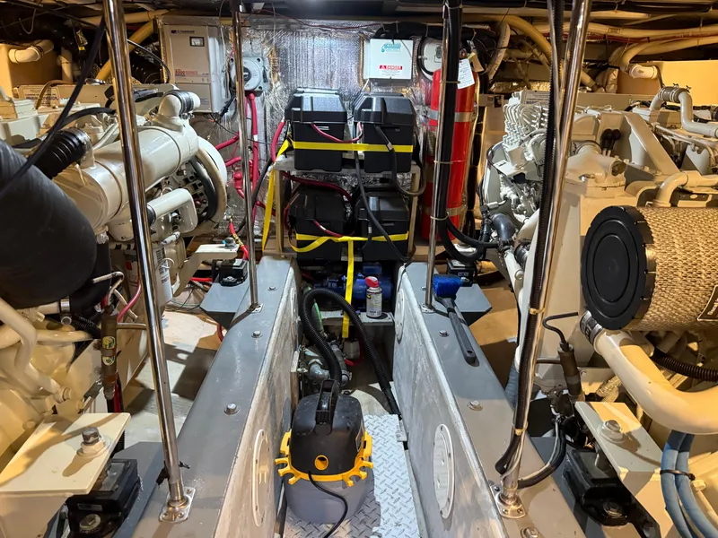 Slide: The Image of Engine room of a 1998 Carver 530 Voyager yacht, showcasing machinery and equipment. - 20