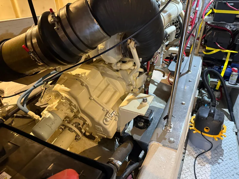 Slide: The Image of Engine room of 1998 Carver 530 VOYAGER yacht, showcasing mechanical components and equipment. - 21