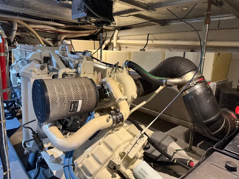 Slide: The Image of Engine room of a 1998 Carver 530 VOYAGER yacht, showcasing mechanical components. - 23